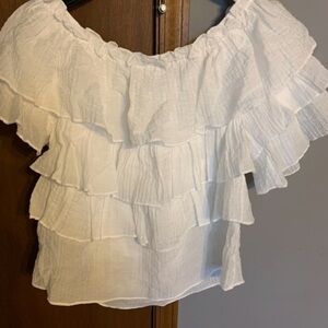 Umgee BOUTIQUE TOP. White ruffles,size Medium. Can be worn on/off the shoulder